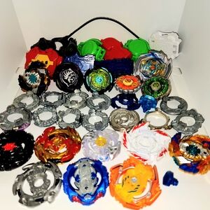 large lot of assorted Beyblades, parts, launchers, and rip cords